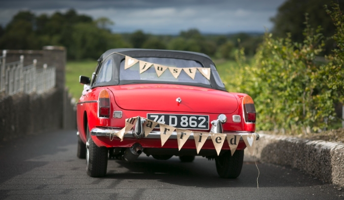 red vintage car just married sign
